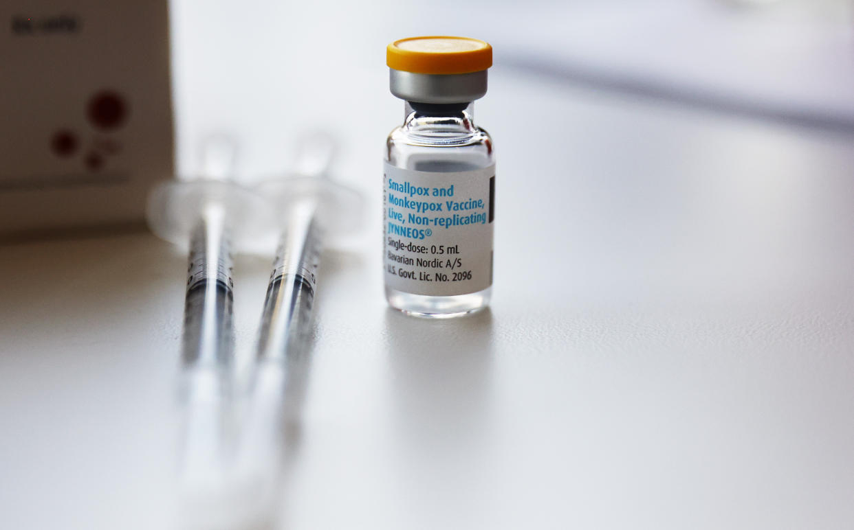 A vial of the monkeypox vaccine, which is in limited supply, along with two syringes.