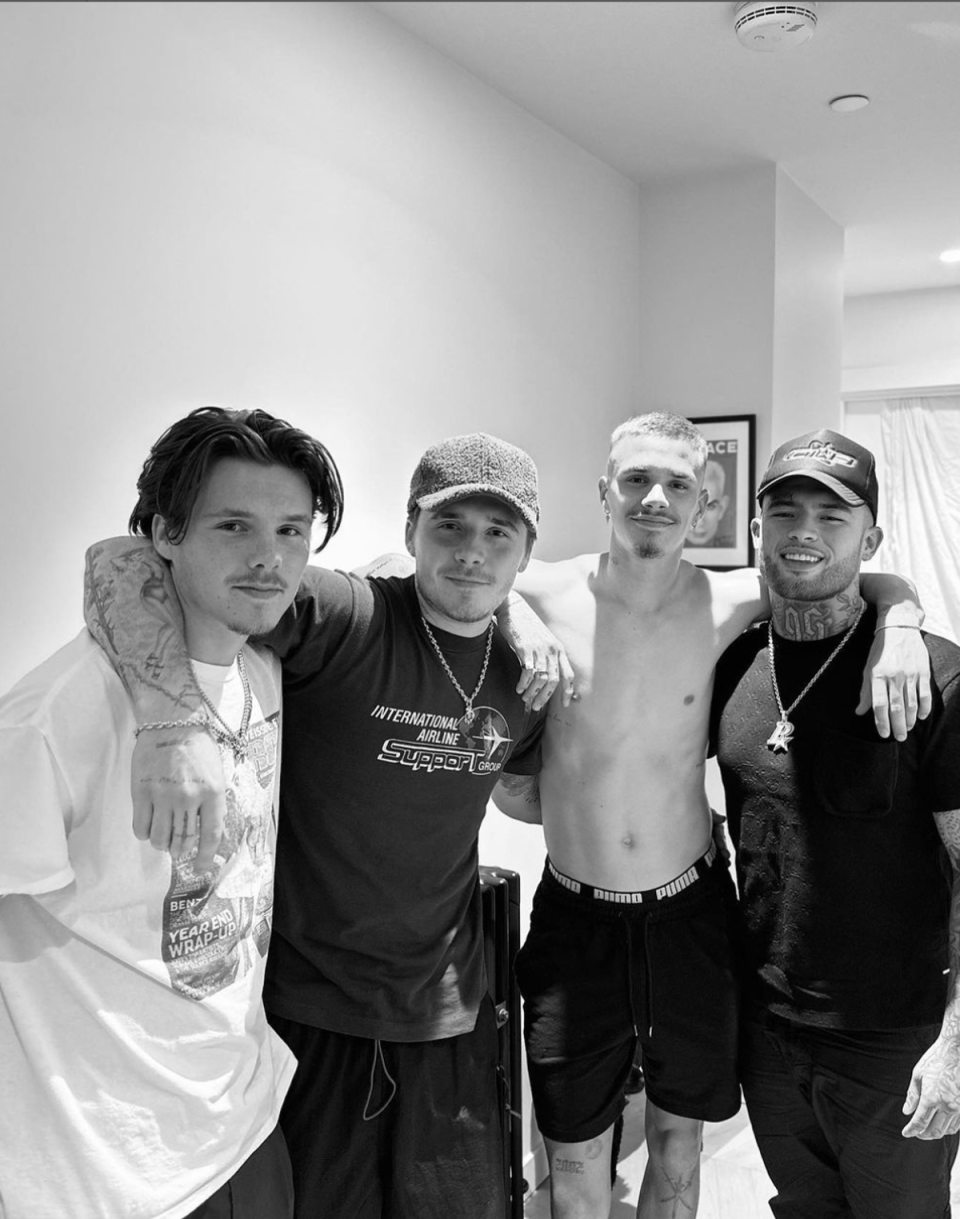 The Beckham brothers posing with their tattoo artist (Instagram via @certifiedletterboy)