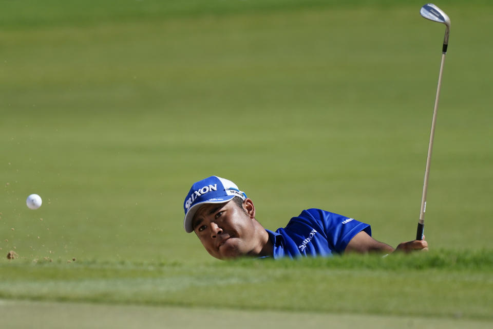 Hideki Matsuyama, of Japan, hits out of the first bunker during the third round of the Sony Open golf tournament, Saturday, Jan. 15, 2022, at Waialae Country Club in Honolulu. (AP Photo/Matt York)