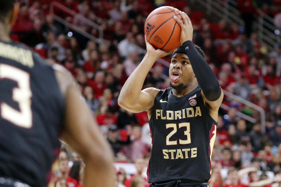 Florida State's M.J. Walker (23) shoots a jump shot against North Carolina State during the second half of an NCAA college basketball game in Raleigh, N.C., Saturday, Feb. 22, 2020. (AP Photo/Karl B DeBlaker)