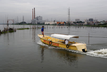 A rescue boat is pictured near the shoreline of Laguna de Bay, before Typhoon Mangkhut hits the main island of Luzon, in Muntinlupa, Metro Manila, in Philippines, September 14, 2018. REUTERS/Erik De Castro