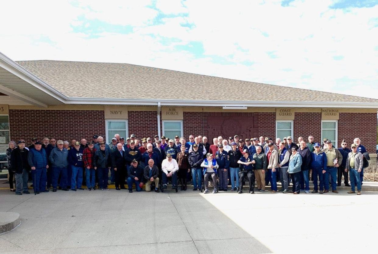 Around 95 veterans pose for a photo during the Vietnam Era Veteran Recognition Event on Saturday, March 25 at the Veteran Reception Center in Van Meter.