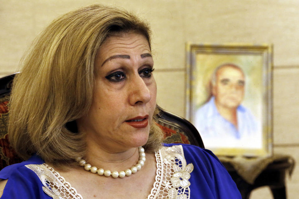 Leila Saleh, wife of Lebanese citizen Mohammed Saleh, who was detained in Greece last week, speaks during an interview at their home in a suburb of the southern port city of Sidon, Lebanon, Tuesday, Sept. 24, 2019. Saleh was detained on suspicion of involvement in the 1985 TWA hijacking and set free after it turned out to be a case of mistaken identity. Saleh is in good health and expected to fly back to Lebanon, he and his wife said Tuesday. (AP Photo/Bilal Hussein)