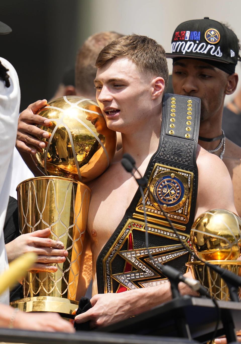 Denver Nuggets guard Christian Braun celebrates during a rally to mark the Denver Nuggets first NBA basketball championship Thursday, June 15, 2023, in Denver. (AP Photo/Jack Dempsey)