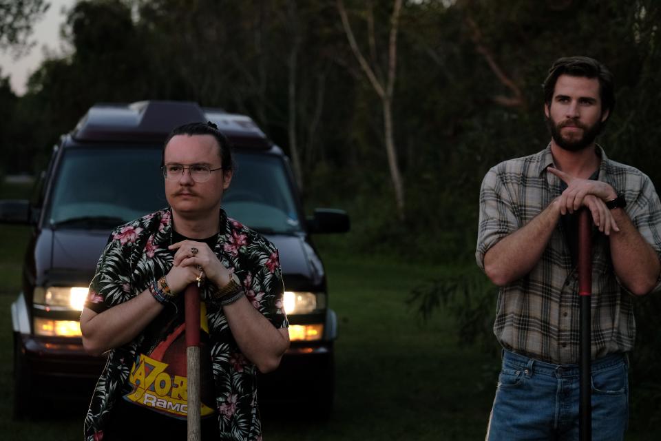 Clark Duke (left) and Liam Hemsworth play drug dealers who work for a mysterious kingpin named Frog in the dark comedy "Arkansas."