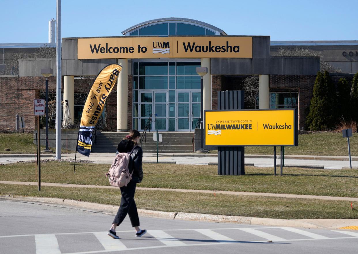 A student heads to the University of Wisconsin-Milwaukee Waukesha campus in Waukesha on Monday, March 11, 2024. The Waukesha campus will close at the end of the spring 2025 semester, eliminating an educational option that has been around since 1966.