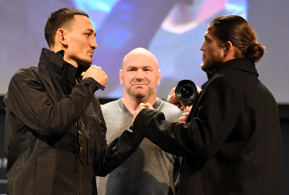 Max Holloway (left) and Brian Ortega face off during the UFC 231 press conference at the Winter Garden Theatre on Dec. 5, 2018, in Toronto. (Getty Images)