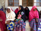 Parents of the missing Dapchi school girls wait for the arrival of Nigeria's President Muhammadu Buhari at the Goverment girls' science and technical college in Dapchi, Nigeria March 14, 2018. REUTERS/Ola Lanre