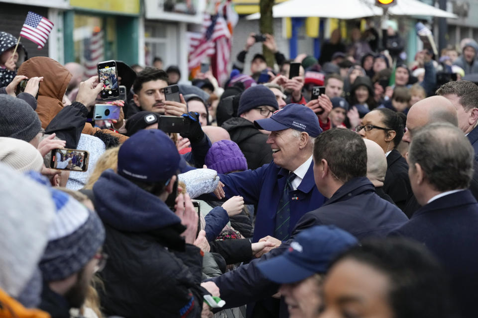 President Joe Biden greets people as he does a walkabout in Dundalk, Ireland, Wednesday, April 12, 2023. (AP Photo/Patrick Semansky)