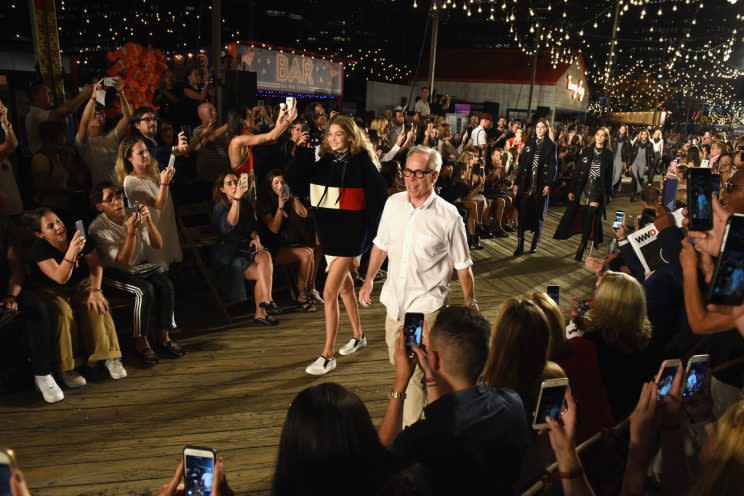 Model Gigi Hadid and designer Tommy Hilfiger walk the runway at the #TOMMYNOW Women’s Fashion Show during New York Fashion Week in September. This year, Hilfiger will take his NYFW show to California. (Photo: Getty Images)