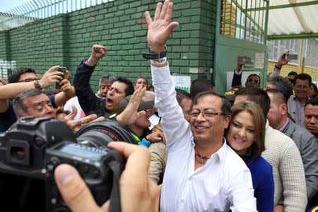 Gustavo Petro, presidential candidate, greets people after they cast their vote during the legislative elections in Bogota, Colombia March 11, 2018. REUTERS/Felipe Caicedo