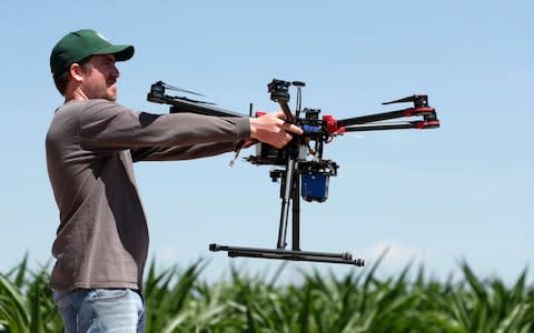 Farmers have turned to drones to improve their crop yield and reduce the amount of waste they generate - Credit: David Zalubowski/AP