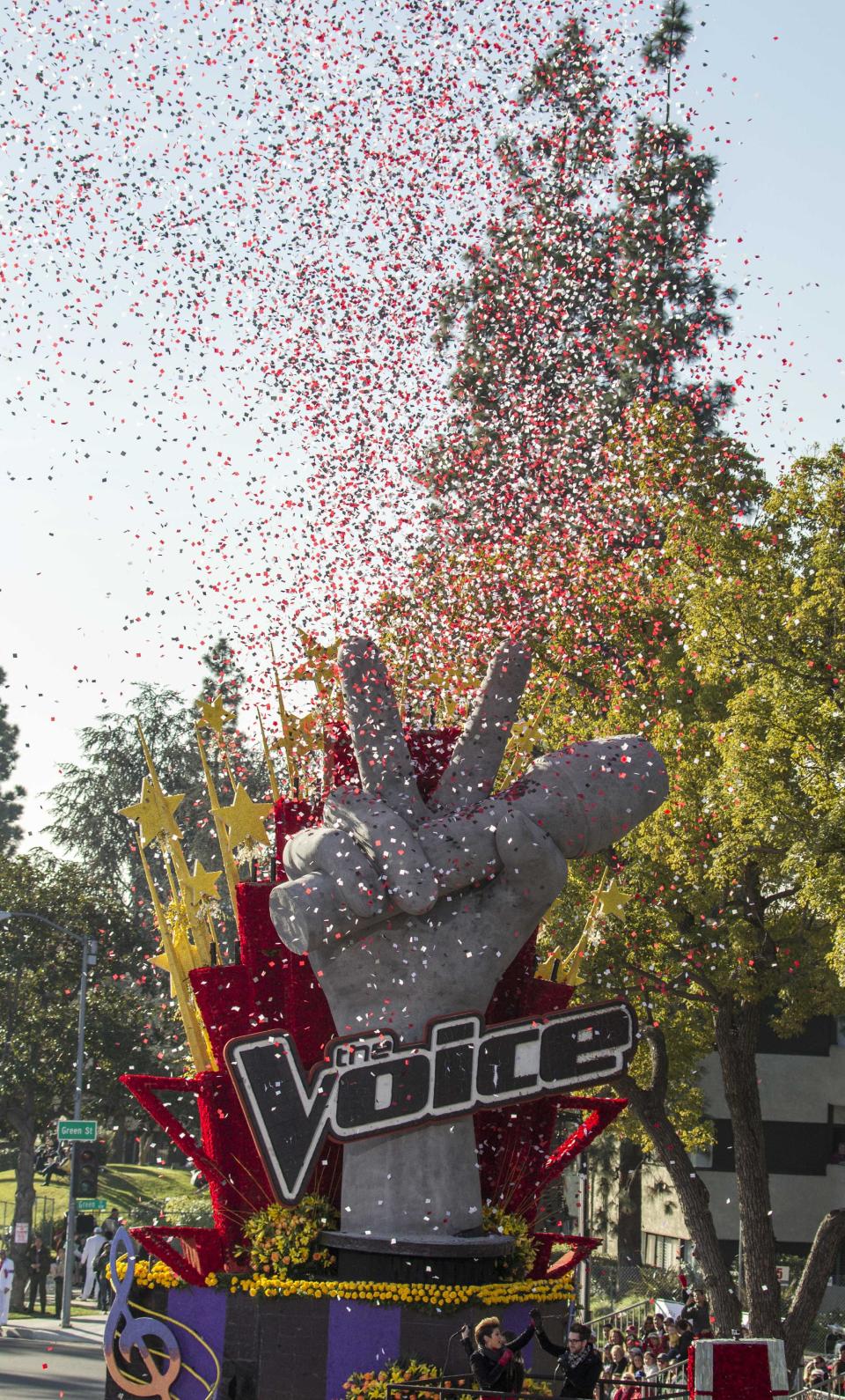 NBC's The Voice float "Singing the Dream" moves along Orange Grove Boulevard during the 125th Tournament of Roses Parade in Pasadena, Calif., Wednesday, Jan. 1, 2014. (AP Photo/Ringo H.W. Chiu)