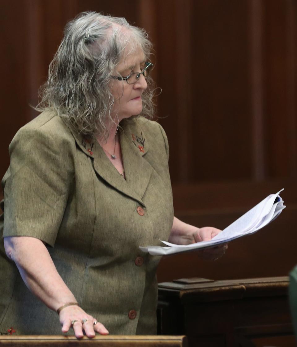 Amy Huston looks over her notes before addressing the court in support of her son William Huston during his sentencing in Summit County Common Pleas Judge Tammy O'Brien's courtroom.