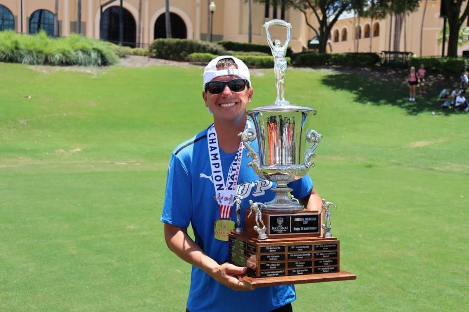 Moeller soccer coach Mike Welker celebrates his final CUP Gold game with a U16 USYS national championship in Orlando.