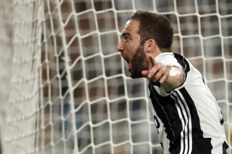 Juventus' forward Gonzalo Higuain celebrates after scoring during the Italian Serie A match against Fiorentina