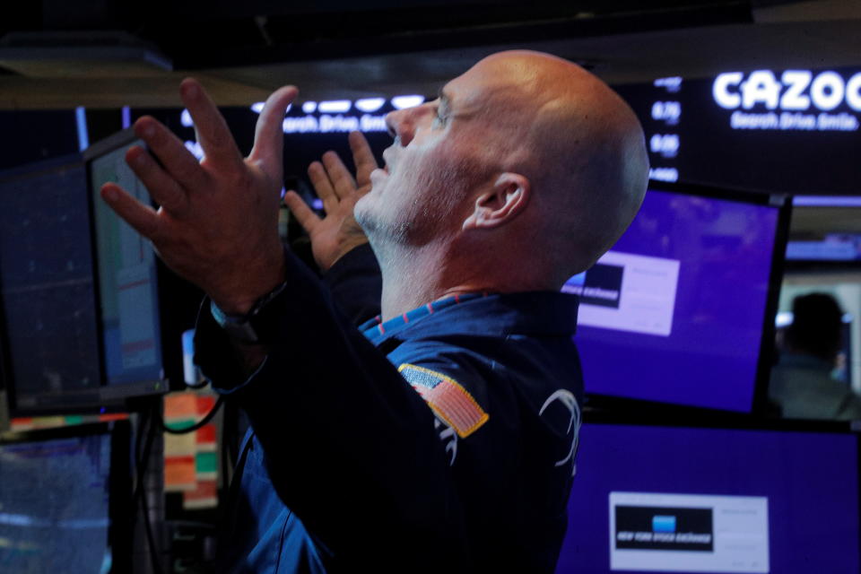 A trader works inside a post on the floor of the New York Stock Exchange (NYSE) in New York City, U.S., August 27, 2021.  REUTERS/Brendan McDermid