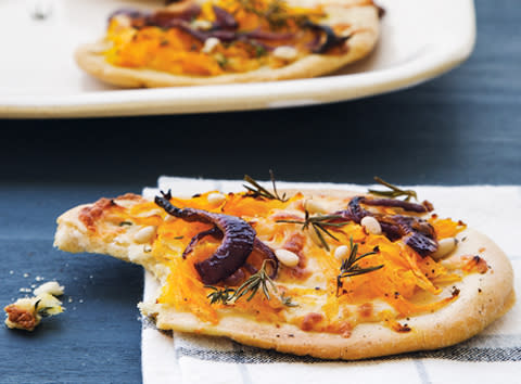 Grated butternut pumpkin, pine nuts, feta and red onion pizza.
