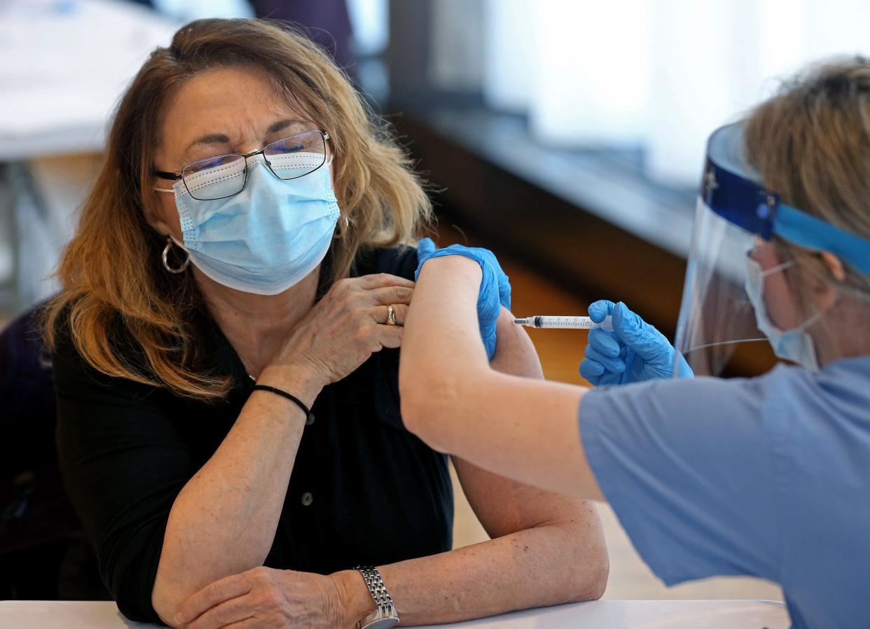 woman getting vaccine