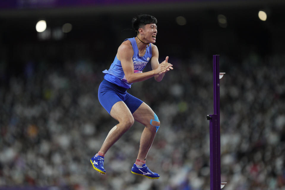 Taiwan's Cho Chia-Hsuan reacts during the men's decathlon high jump at the 19th Asian Games in Hangzhou, China, Monday, Oct. 2, 2023. (AP Photo/Vincent Thian)