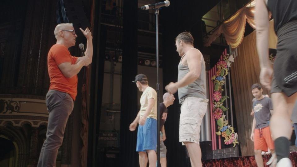 Jeffrey Drew (L) choreographs a number for an AIDS fundraiser - Credit: Peacock