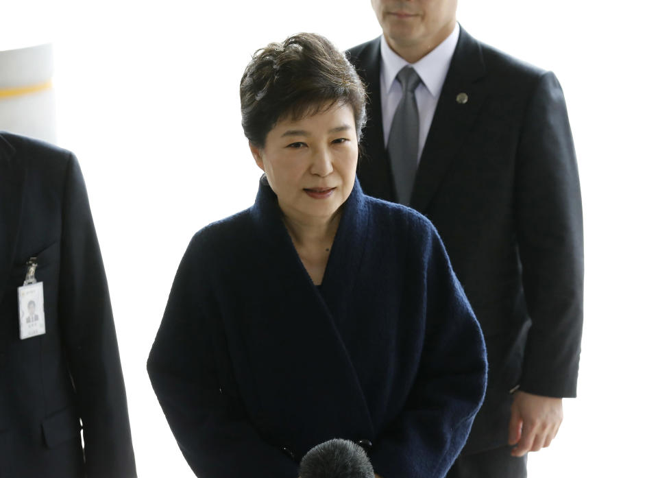 <p> FILE - In this March, 21, 2017 file photo, South Korea's ousted leader Park Geun-hye arrives at a prosecutor's office in Seoul, South Korea. Media reports say that South Korean prosecutors have decided to ask a court issue a warrant to arrest former President Park Geun-hye on corruption allegations. Yonhap news agency reported Monday, March 27 2017, that prosecutors reached the decision after they grilled Park last week over suspicions she colluded with a jailed confidante to extort from companies and allowed the friend to secretly interfere with state affairs.(Kim Hong-ji/Pool Photo via AP, File) </p>