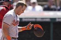 Baltimore Orioles' Pat Valaika drops his helmet after striking out in the eighth inning of a baseball game against the Cleveland Indians, Thursday, June 17, 2021, in Cleveland. (AP Photo/Tony Dejak)