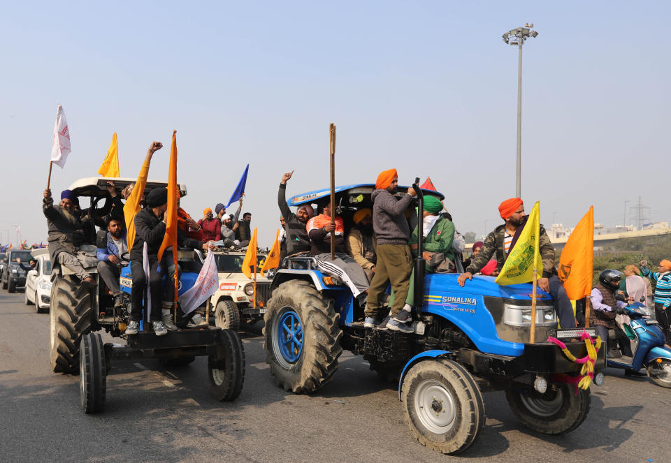 DELHI, INDIA - 2021/01/26: Farmers' Tractors Parade seen heading towards Delhi during the demonstration. Farmers protesting against agricultural reforms breached barricades and clashed with police in the capital on the India's 72nd Republic Day. The police fired tear gas to restrain them, shortly after a convoy of tractors trundled through the Delhi's outskirts. (Photo by Amarjeet Kumar Singh/SOPA Images/LightRocket via Getty Images)