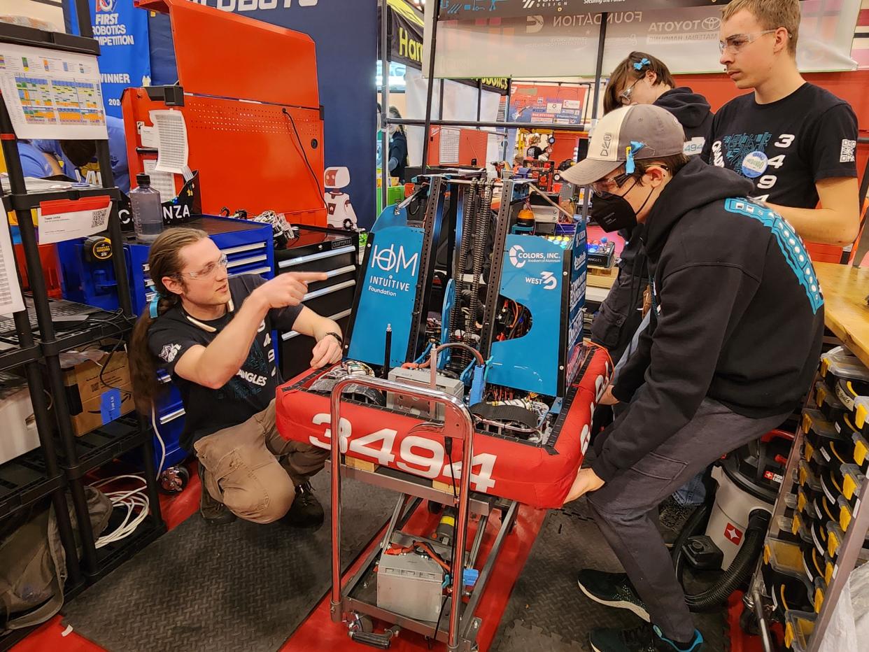 From left: Alex von Hoene, Ashton Shalley, Kennan Hunter, and Klee Sill, all members of The Quadrangles robotics team at Bloomington High School South, ready their robot to compete at the F.I.R.S.T. Indiana Robotics state championship in Lafayette.