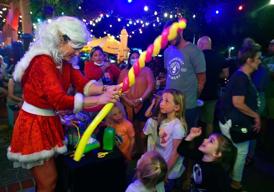 The annual Light Up Siesta Key takes place in Siesta Key Village on Saturday.