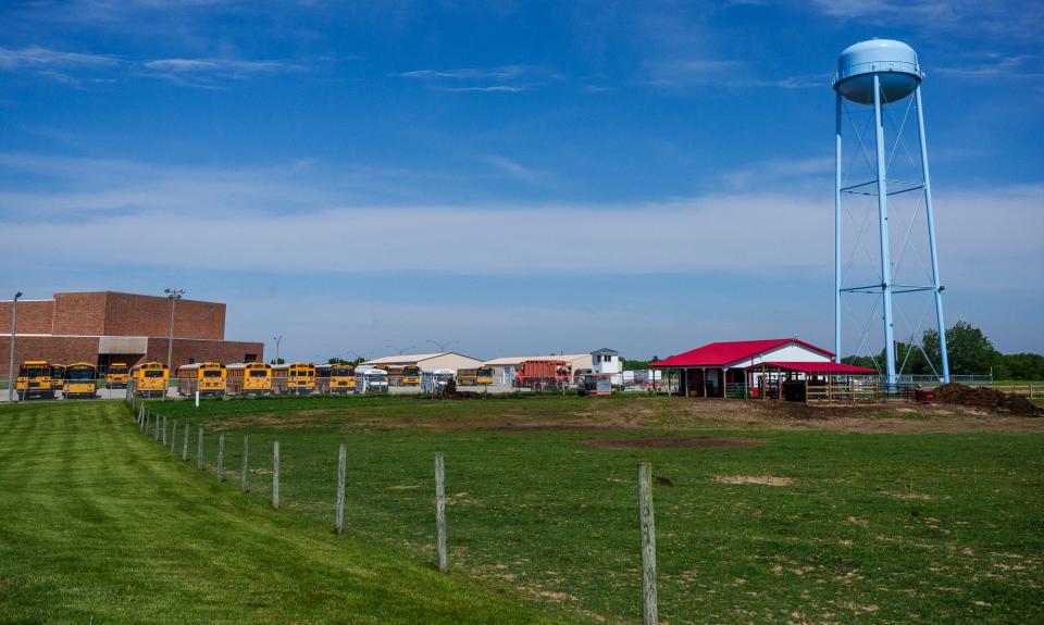 A small cattle farm sits in the middle of the Maconaquah School District's campus Tuesday, May 31, 2022, in Bunker Hill, Indiana. Students in the school's farm-to-school cattle program care for 20 head of cattle, a barn, as well as a 45-acre field planted with hay and soybeans. The farm has been in existence for six years and is run by middle school agriculture teacher John Sinnamon. Sinnamon says the school's program is the third in the state to raise cattle but is the first to raise cows and calves.