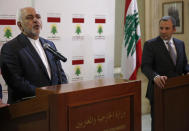 Iranian Foreign Minister Mohammad Javad Zarif, left, speaks during a press conference with his Lebanese counterpart Gebran Bassil, in Beirut, Lebanon, Monday, Feb. 11, 2019. Zarif extended an offer for Iranian military assistance to the U.S.-backed Lebanese army on Sunday, saying Iran is ready to assist in all sectors should the Lebanese government want it. (AP Photo/Hussein Malla)