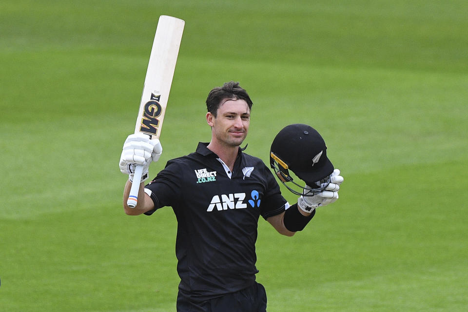 New Zealand player Will Young celebrates after scoring a 100 runs during the first One Day cricket international between New Zealand and Bangladesh at University Oval in Dunedin, New Zealand, Sunday, Dec. 17, 2023. (Chris Symes/Photosport via AP)