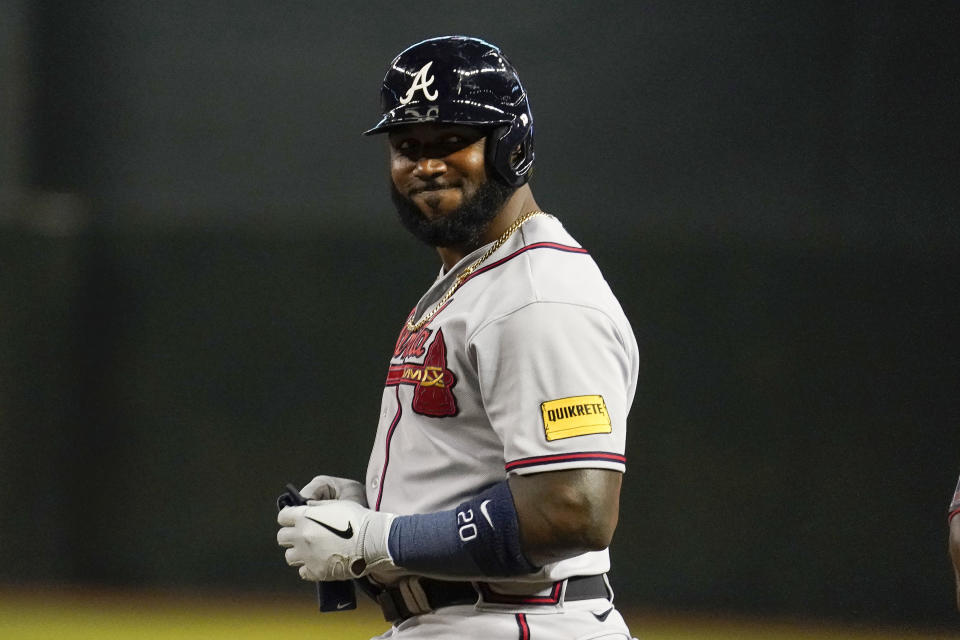 Braves DH Marcell Ozuna got caught ball-watching. (AP Photo/Darryl Webb)