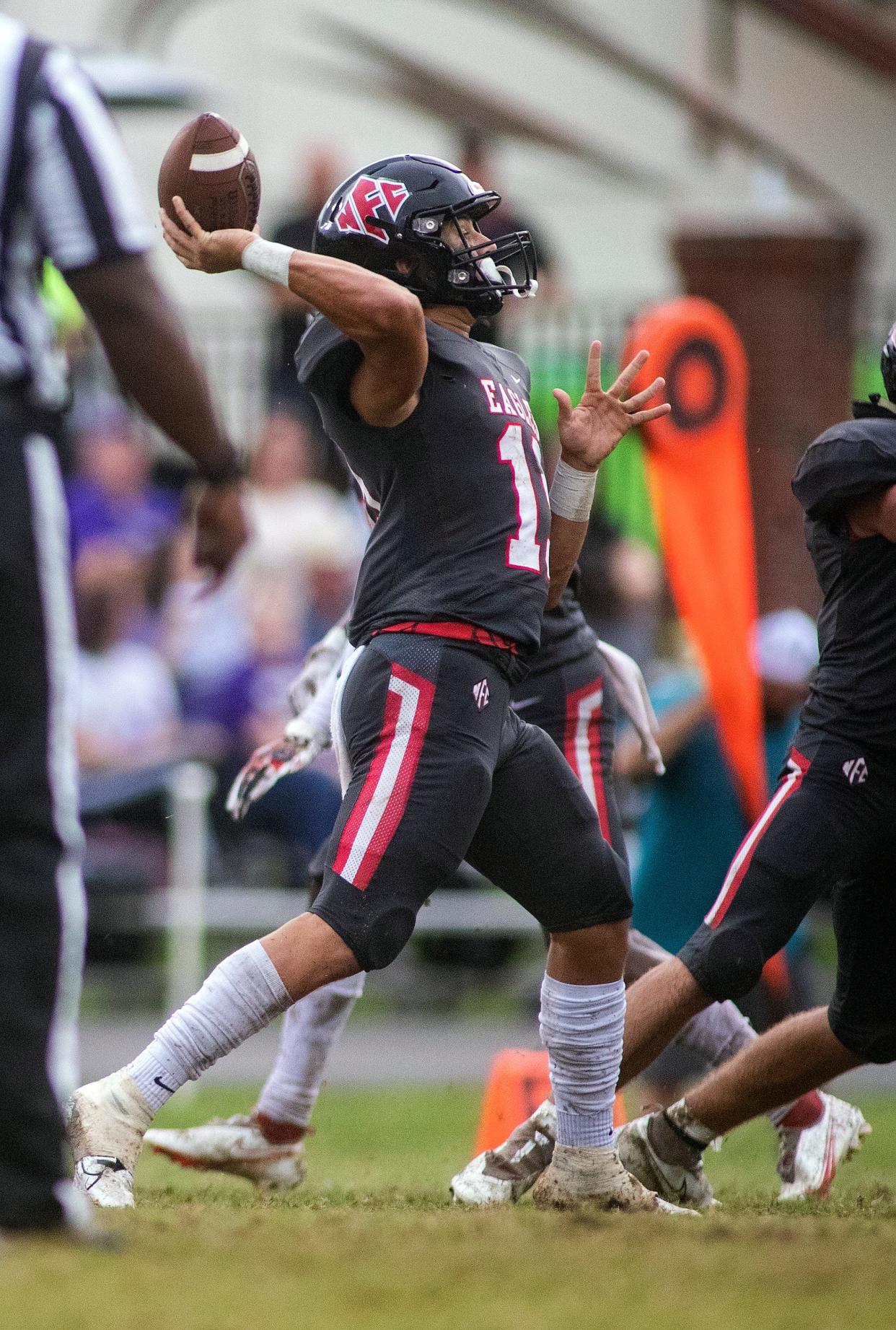 North Florida Christian School quarterback JP Pickles (19) makes a throw.