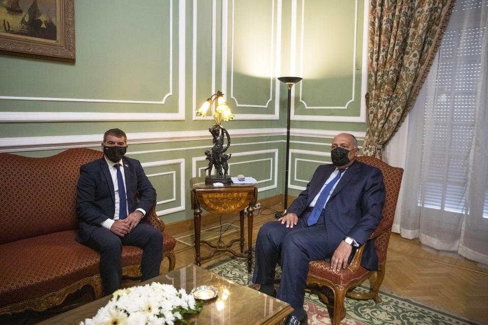 Egyptian Foreign Minister Sameh Shoukry, right, meets with Israeli Foreign Minister Gabi Ashkenazi at the Tahrir Palace in Cairo, Egypt, Sunday, May 30, 2021. (AP Photo/Nariman El-Mofty)