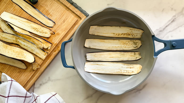 eggplant strips frying in pan