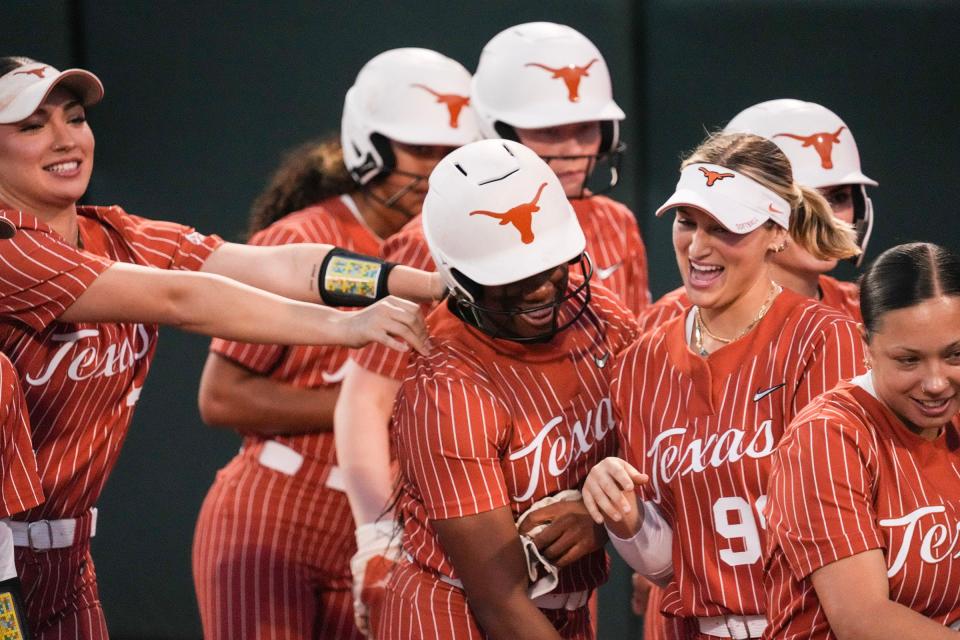 Teammates cheer for Texas infielder Victoria Hunter, center, after the freshman blasted a home run in Wednesday's 14-1 win over Houston Christian at McCombs Field. This weekend the Longhorns will host the Lone Star Invitational, which includes a meeting with No. 9 Stanford on Saturday.