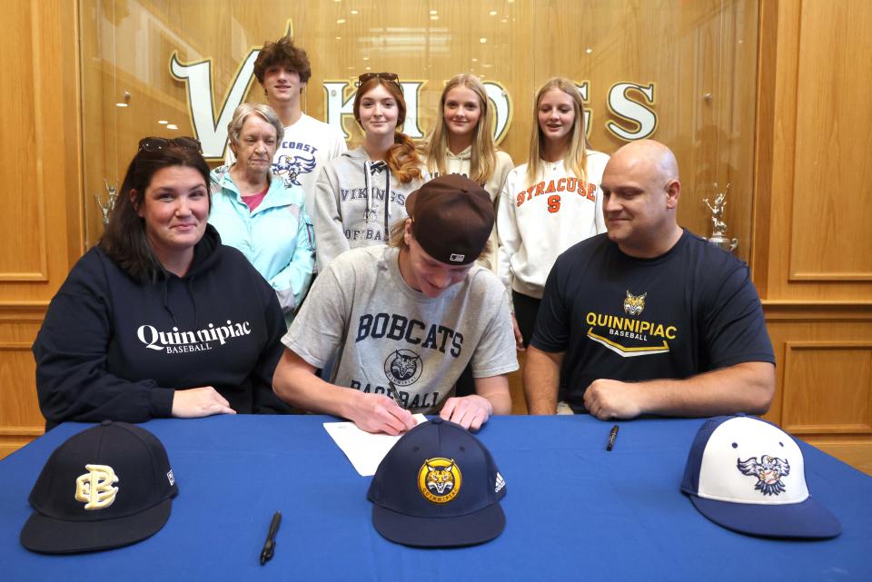 East Bridgewater senior Ray McNaught signs his letter of intent to play baseball at Quinnipiac University in a ceremony at East Bridgewater Junior/Senior High School on Wednesday, Nov. 9, 2022. McNaught, was joined by his parents (Dave and Meghan), siblings (David, Kaitlyn, Elizabeth and Emily), grandmother (Anna McNaught) with teammates and coaches. 