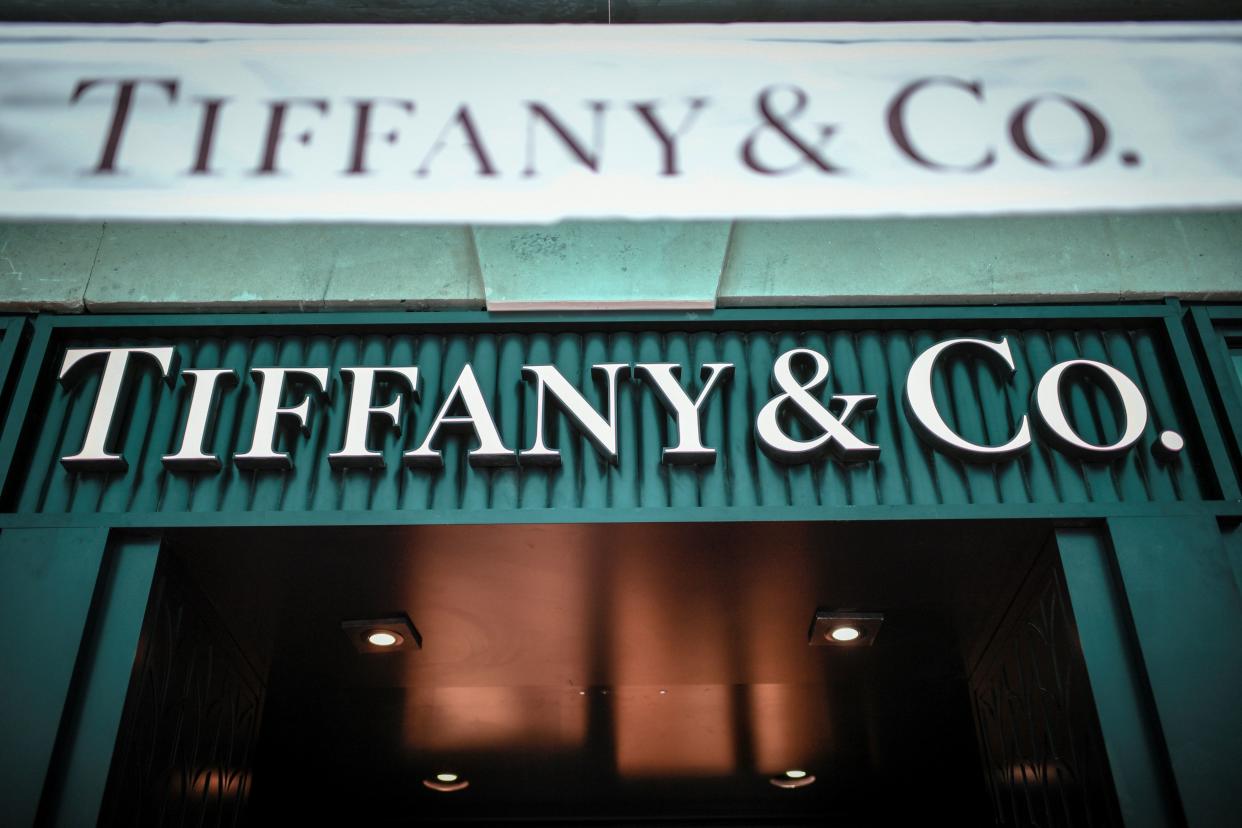 A picture taken on October 29, 2019 shows the US luxury shop Tiffany&Co.'s logo outside a Tiffany&Co. Shop in Paris. - French luxury giant LVMH said on October 28, 2019 it was exploring a takeover of US jewellers Tiffany, most famous for its fine diamonds and luxury wedding and engagement rings. (Photo by STEPHANE DE SAKUTIN / AFP) (Photo by STEPHANE DE SAKUTIN/AFP via Getty Images)