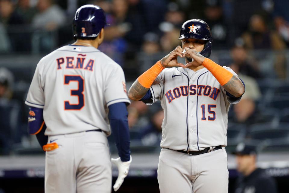 Astros teammate Martin Maldonado congratulates shortstop Jeremy Peña on his crucial three-run home run in the third inning of ALCS Game 4.