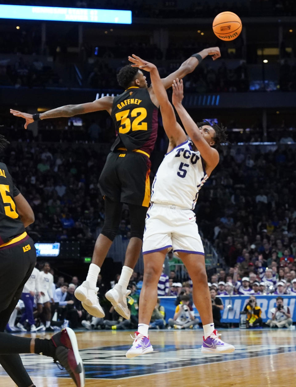 Arizona State forward Alonzo Gaffney, left, blocks a shot by TCU forward Chuck O'Bannon Jr. (5) in the first half of a first-round college basketball game in the men's NCAA Tournament, Friday, March 17, 2023, in Denver. (AP Photo/John Leyba)