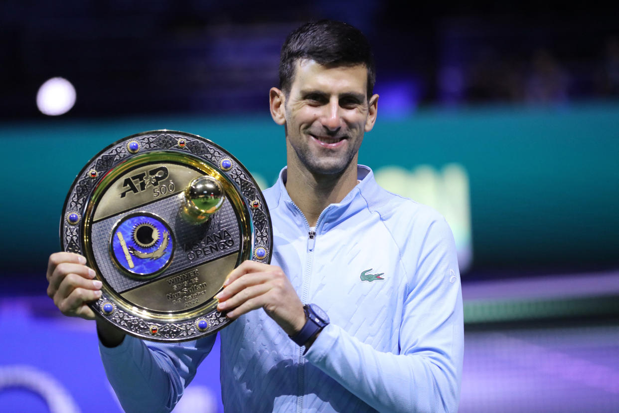 Tennis - ATP 500 - Astana Open - National Tennis Center, Astana, Kazakhstan - October 9, 2022 Serbia's Novak Djokovic poses with a trophy after winning the men's singles final against Greece's Stefanos Tsitsipas REUTERS/Pavel Mikheyev