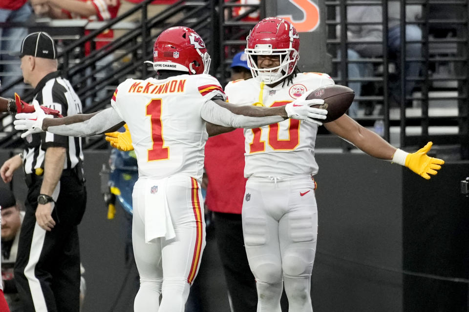 Kansas City Chiefs running back Jerick McKinnon (1) is congratulated by Isiah Pacheco (10) after scoring during the first half of an NFL football game Las Vegas Raiders Saturday, Jan. 7, 2023, in Las Vegas. (AP Photo/John Locher)