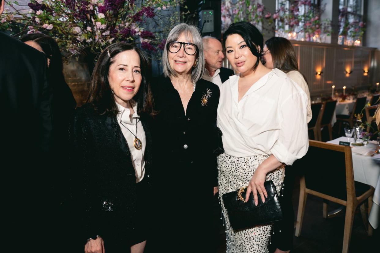 a group of women posing for a photo