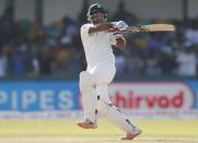 India's Cheteshwar Pujara hits a boundary during the second day of their third and final test cricket match against Sri Lanka in Colombo , August 29, 2015. REUTERS/Dinuka Liyanawatte