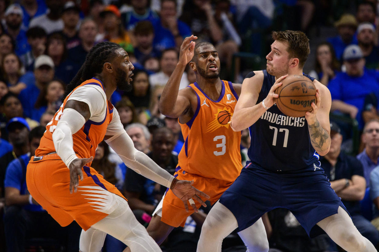 Phoenix Suns guard Chris Paul and forward Jae Crowder double-team Dallas Mavericks guard Luka Doncic during Game 4 at American Airlines Center. (Jerome Miron/USA TODAY Sports)