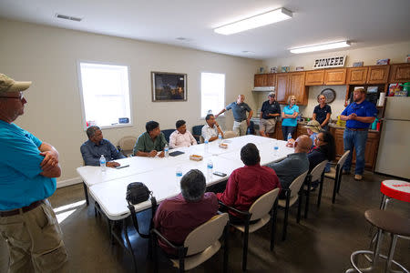 Members of Illinois Soybean Growers Association and a trade group of grain buyers from Sri Lanka attend a meeting at the Pioneer-DuPont Seed facility in Addieville, Illinois U.S., September 19, 2018. Picture taken September 19, 2018. REUTERS/Lawrence Bryant