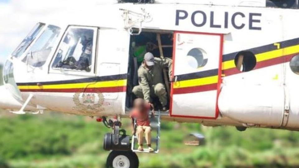 Boy is rescued from floodwaters