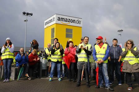 Workers and Verdi union members protest during strike action outside the Amazon.de distribution centre in Bad Hersfeld September 22, 2014. REUTERS/Kai Pfaffenbach